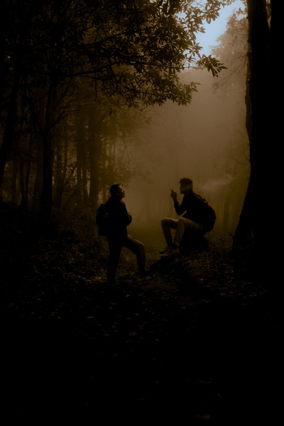Survivors gathered by lantern light in an underground shelter